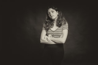 woman in black and white striped shirt