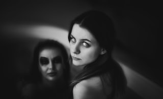 A black and white photo of two women